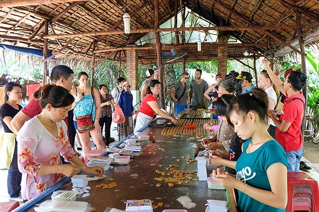 See the local making rice papers at their workshop, Cozy Vietnam Tours, Vietnam Package Tours