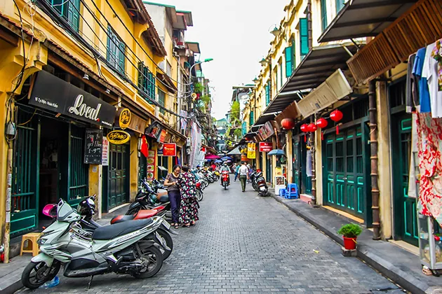 Busy Old Quarter Hanoi street showing typical motorbike traffic